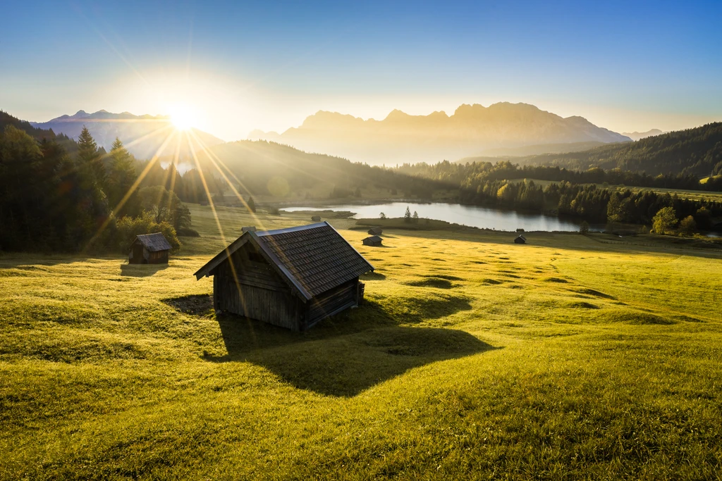 Sun peaks over the bavarian alps